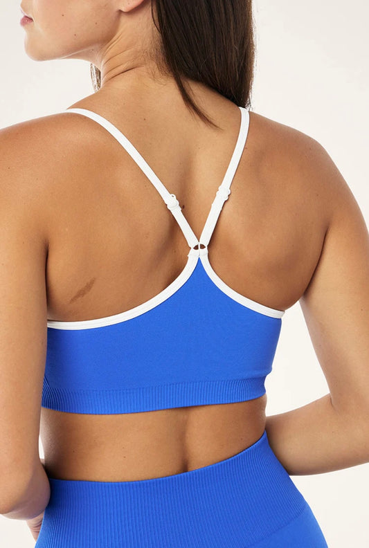 P.E. NATION RELEASE SEAMLESS SPORTS BRA IN ROYAL BLUE